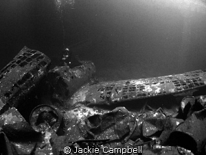 Zeros in the cargo hold of the Fujikawa Maru.
Natural li... by Jackie Campbell 